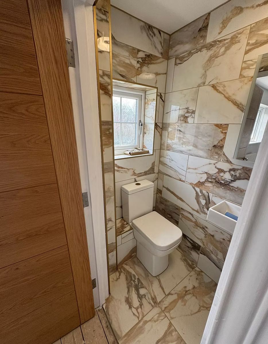 Marble-tiled bathroom, recently fitted